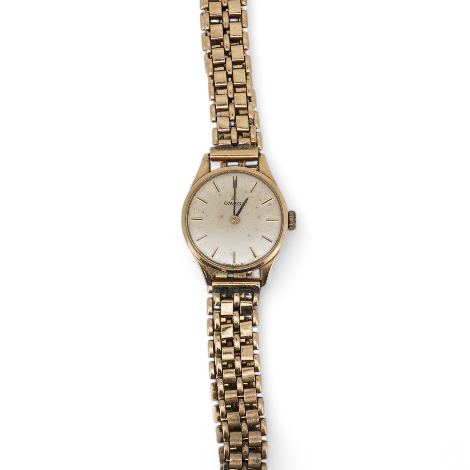 A lady's 9ct gold Omega manual wind wrist watch, with baton numerals, case diameter 20mm, on an associated 9ct gold bracelet. Gross weight 21.2 grams. Condition - poor to fair.